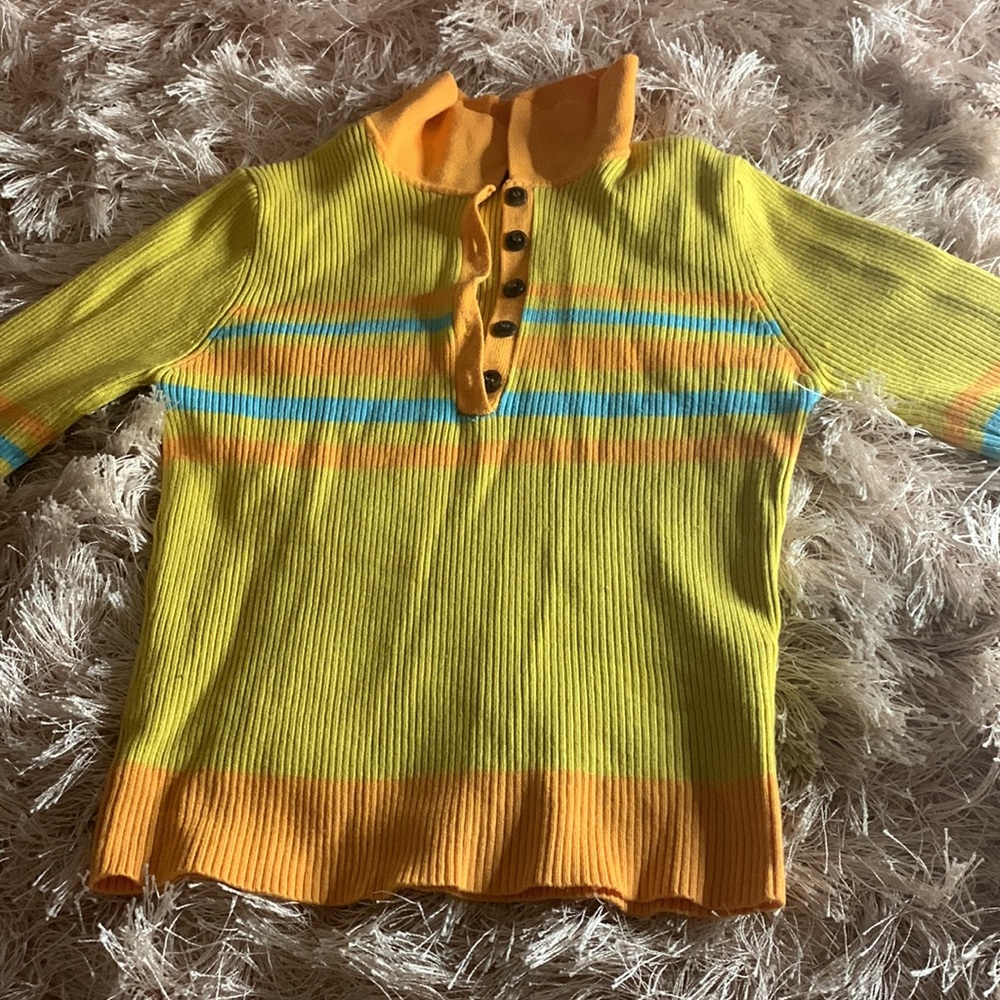 an multi colored turtleneck top.